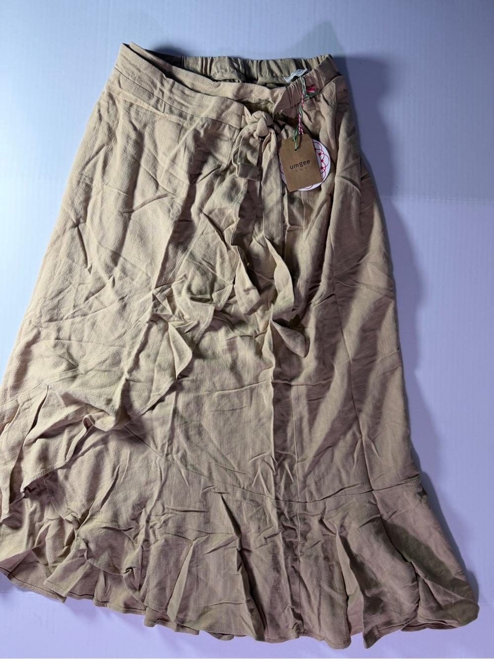 Umgee linen blend Tan Tie-Front Ruffle Hem Skirt (wrinkling from storage)